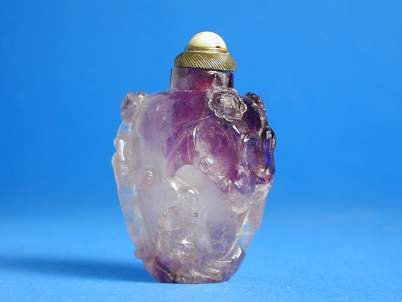 Amethyst Snuff Bottle with high relief design on sides of plum blossoms & birds