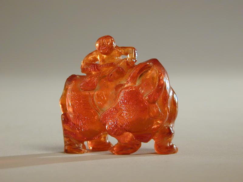 Amber Figurine of Boy on a Water Buffalo