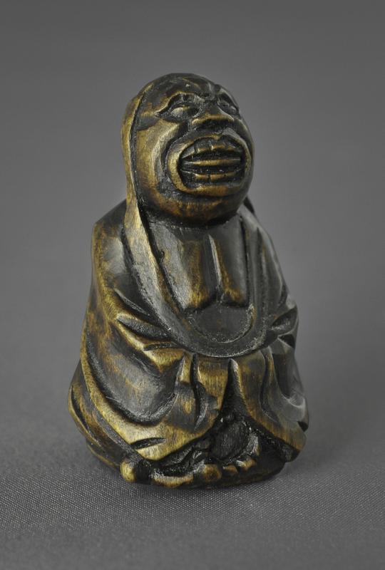 Netsuke of a Daruma with a Rosary