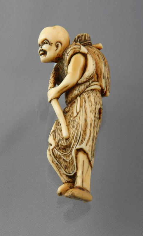 Netsuke:  Farmer Carrying a Rice Sheaf