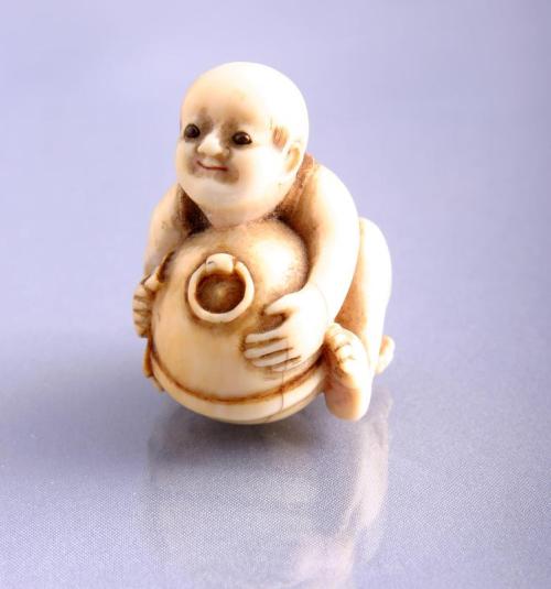 Netsuke: A Karako Polishing a Mokugyo