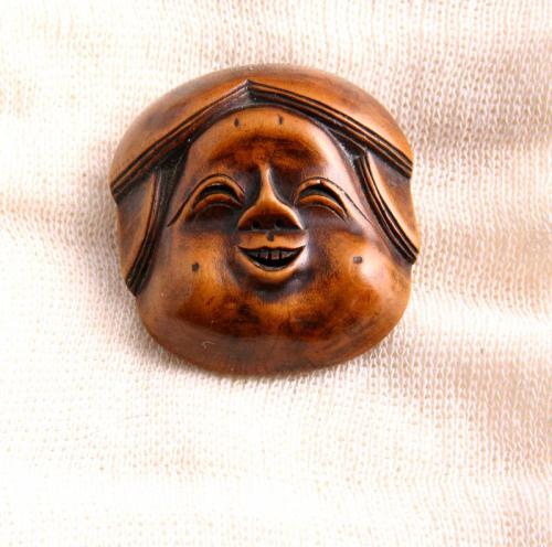 Netsuke: Wooden Mask of Okame