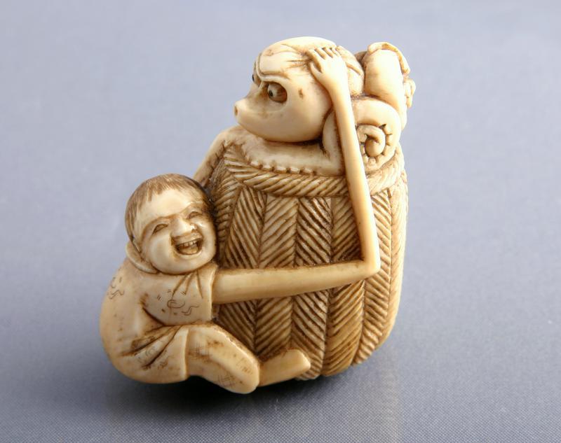 Ivory Netsuke:  Long Armed Tenaga Holding an Octopus in a Basket