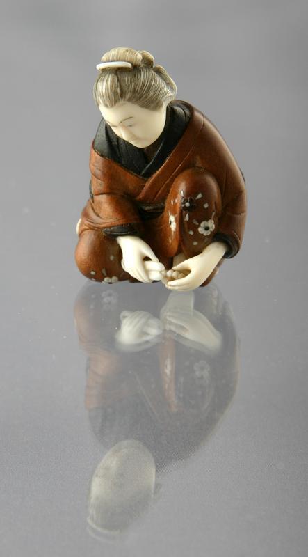 Netsuke: Woman Trimming her Toenails