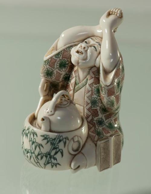 Figurine of a Man with a Teapot