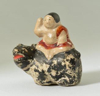 Figure Sitting Sideways on Animal