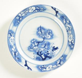 Plate with underglaze blue design of plum tree and bamboo sprays