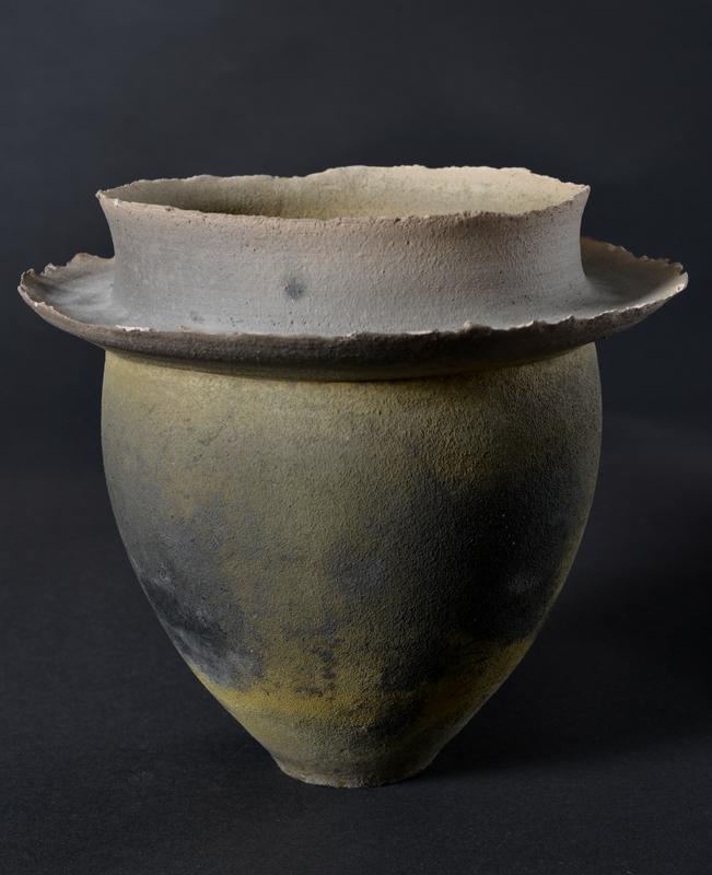 Raku fired vase with outer ledge