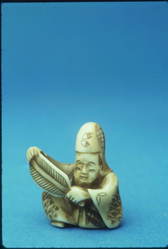 Netsuke depicting a Figure with a Fan