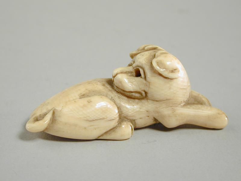 Netsuke shaped like a Reclining Dog